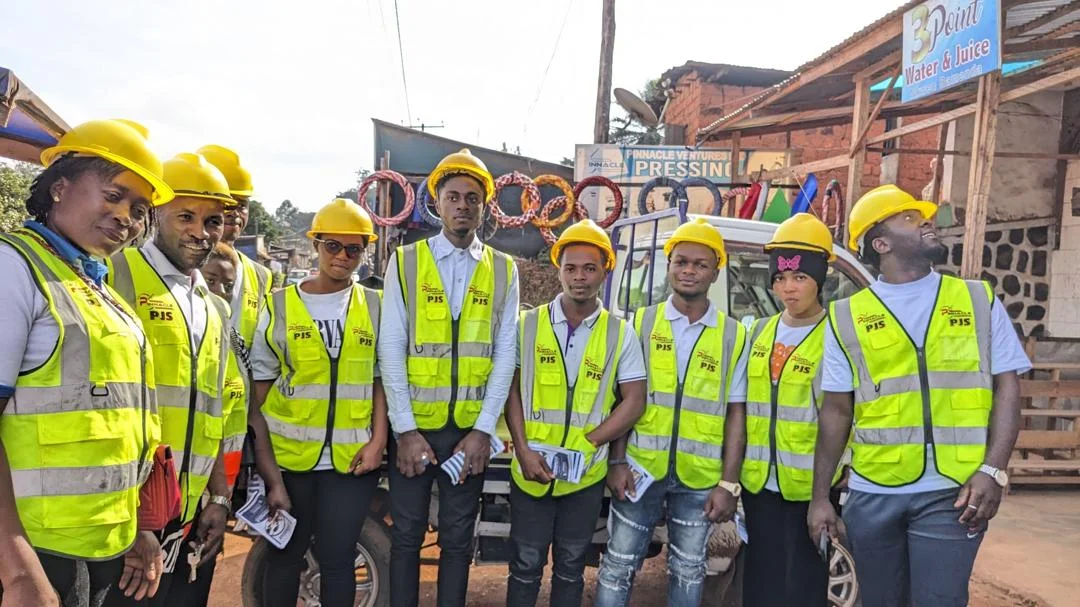 The Pinnacle cleaning team outside their Bamenda premises